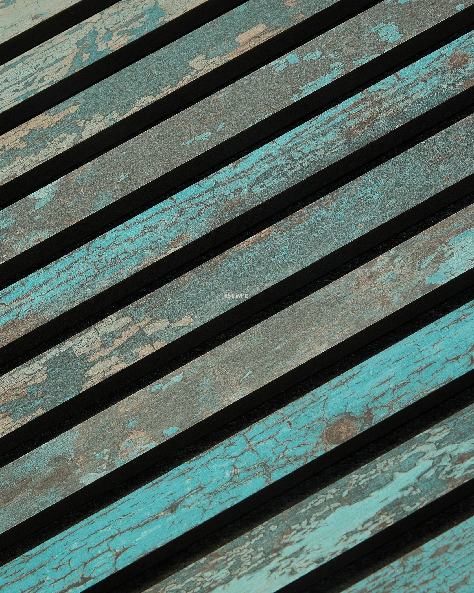 Fire-rated commercial timber acoustic paneling on the wall of a busy modern restaurant.